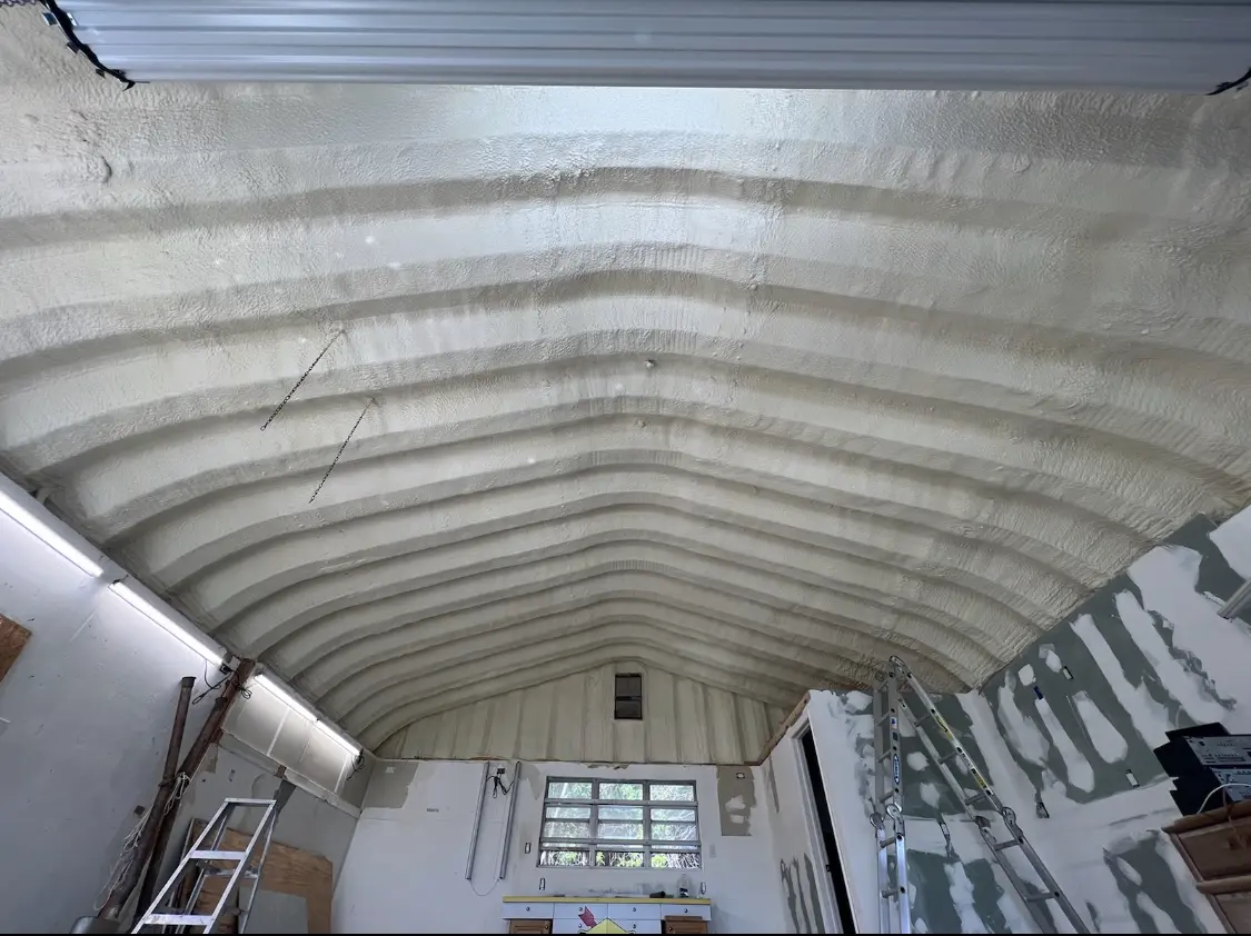 Spray polyurethane foam applied to the underside of a metal roof deck in Newburyport